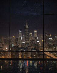 Poster - A nighttime cityscape is visible through a window, with the illuminated skyscrapers and roads reflecting on the glass