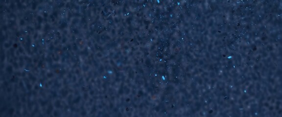Poster - a dark blue background with numerous small, blue and white particles scattered throughout, creating a sense of movement and energy
