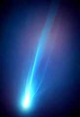 Leinwandbilder - A bright, blue comet streaks across the dark blue background, creating a striking visual effect