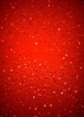 Poster - a close-up view red surface with small, irregularly shaped white and black speckles scattered across it, creating a textured and abstract pattern