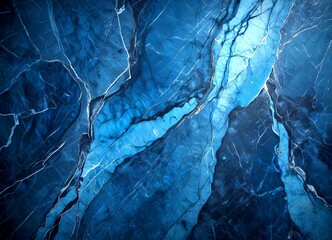 Leinwandbilder - a close-up view marble surface with a dark blue hue, featuring a complex pattern of white and blue lines and cracks