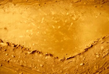 Poster - a close-up view textured surface, possibly a stone or brick wall, with a golden-brown hue and small specks of dirt or sand
