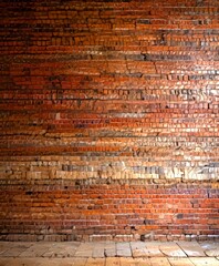 Fototapete - a close-up view brick wall, with the bricks arranged in a horizontal pattern and displaying a range of colors from reddish-brown to reddish-orange The bricks are