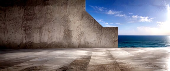 Poster - a concrete wall with a large, curved section on the right side, overlooking a vast body of water The sky above is clear blue with scattered clouds