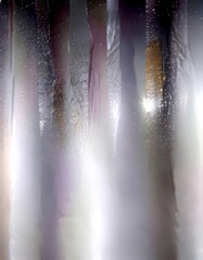 Fototapete - a series of vertical, translucent, and textured lines that appear to be made translucent material, possibly glass or plastic The lines are arranged in a vertical