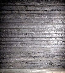 Aufkleber - a dark, textured brick wall with visible cracks and uneven surfaces, creating a sense of depth and texture