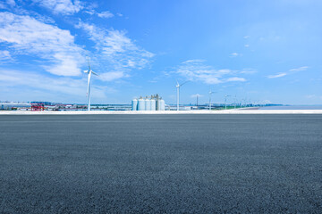Aufkleber - Asphalt road and wind turbines with industrial buildings