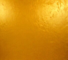 Fototapete - a close-up view shiny, golden-colored surface with a textured, slightly crumpled appearance