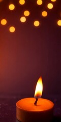 Fototapete - A single orange candle with a flickering flame is the focal point, set against a dark background with scattered orange lights