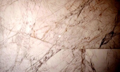 Fototapete - a close-up view marble surface, with a textured and irregular pattern of white and gray marble tiles