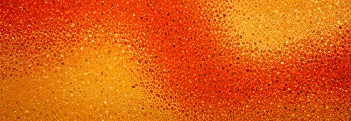Poster - a close-up view textured surface with a gradient of warm colors, featuring a pattern of small dots or specks in shades of red, orange, and yellow
