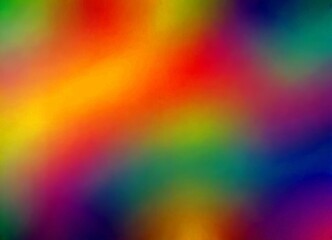 a blurred, abstract representation rainbow, with a gradient of colors transitioning from red to orange, yellow, green, blue, and purple