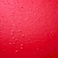 Poster - A close-up pink surface with small water droplets scattered across it, creating a textured and abstract pattern