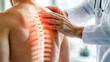 © Dina Photo Stories - Chiropractor examining patient with back pain in clinic. Physiotherapist working examining treating injured back of male patient with spine x-ray visualization, Rehabilitation therapy. spinal health