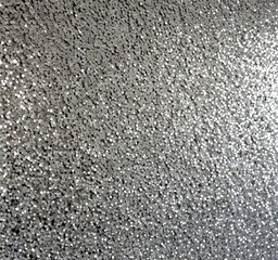 Poster - A close-up view textured surface with a silver glittery appearance, resembling a metallic wall or a decorative background