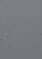 Fototapete - a gray background with small white dots scattered across it, creating a sense of randomness and movement