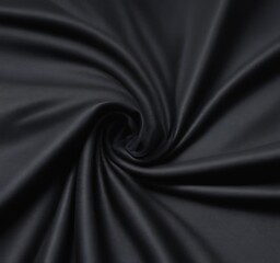 Aufkleber - A close-up view black fabric, possibly silk, with a smooth, shiny texture and a swirling pattern
