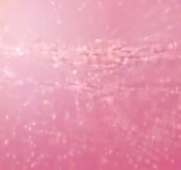 Poster - a blurred, abstract representation pinkish-purple background with a subtle pattern of small white dots or specks