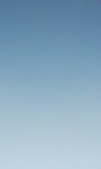 Leinwandbilder - a gradient of blue sky, transitioning from a darker shade at the top to a lighter one at the bottom