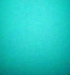Aufkleber - a solid teal background with a subtle texture, resembling a canvas or a piece of paper