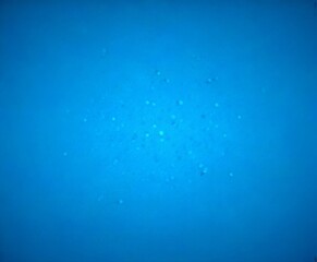 Aufkleber - a gradient background transitioning from a deep blue at the top to a lighter shade at the bottom, with small circular dots scattered throughout the center
