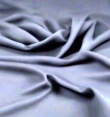 Aufkleber - a close-up view dark, crumpled fabric, likely a type of silk or satin, with a smooth, flowing texture