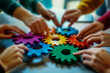© Edgar Martirosyan - A group of people holding colorful gears in their hands, a collaboration and success concept.