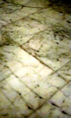 Fototapete - a close-up view white marble surface with a diagonal pattern of small lines, creating a textured and visually appealing effect