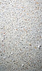 Poster - a close-up view textured surface composed of small, irregularly shaped stones in various shades of gray, white, and brown