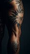 © Good Co Vision - Close-up of a man's thigh with detailed floral tattoos against a dark background