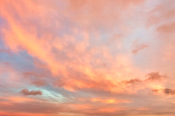 Wall Mural - a beautiful sky tinted by the sun leaving vibrant shades of gold, pink, blue and multicolored. cloud