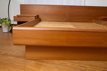 Vintage Queen Bed Frame With Floating Nightstands. Mid-century modern teak furniture. Product photograph.