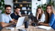 © Pinklife - A group of young professionals is engaged in a friendly and productive meeting within a modern office, illustrating camaraderie, focus, and shared ambition.