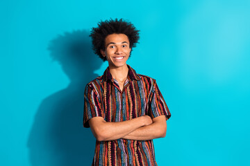 Wall Mural - Portrait of nice young man folded arms wear shirt isolated on turquoise color background