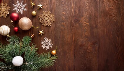 Christmas tree decorations and snowflakes scattered on wooden background with space for text, christmas and new year concept