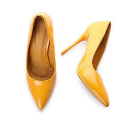 Wall Mural - Stylish yellow high heels on white background