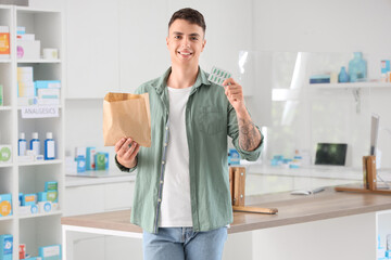 Poster - Male customer with his order at pharmacy