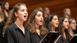 © Bonsales - Group of young women singing in choir, harmonizing voices in unison, music recital performance concept