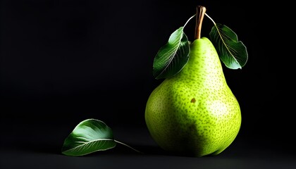 Vibrant green pear with lush leaves against a striking black backdrop