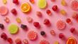 © Elnare - A flat lay of colorful gummies and fruit slices on a pink background.