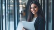 © WS Studio 1985 - Smiling Businesswoman Holding Tablet in Modern Office