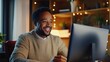 © WS Studio 1985 - Smiling Man Working at Computer in Cozy Environment