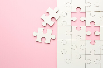 Wall Mural - White puzzle pieces on pink background, top view