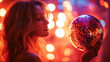 © malik - New year party concept with girl holding disco ball