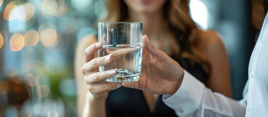 Wall Mural - A Woman Offering a Glass of Water