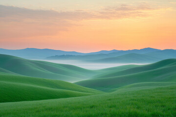 Wall Mural - A serene landscape of rolling green hills under a soft sunrise, creating a tranquil and picturesque scene.