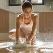 © ChimE - Young woman in a tank top scrubs the kitchen floor postyoga, showcasing her fit and feminine figure amidst soap suds.
