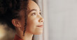 © PeakPoints/peopleimages.com - Profile, woman and planning future in home, thinking or reflection of mindset by window view or curtains. Living room, decision and African girl with vision, ideas and dream on mockup space banner