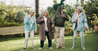 © KayExam/peopleimages.com - Senior people, dancing and bonding in retirement home as pensioners for activity, support or relax. Group, elderly care and happiness for outdoor in garden or backyard as community in nursing village