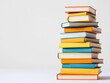 © Mnt - A vibrant stack of colorful books arranged neatly, perfect for educational, library, or reading themes.